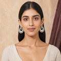 Dual Peacock silver earrings worn on both ears